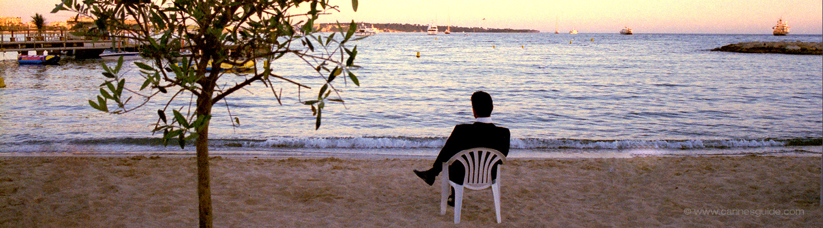 Man in a tuxedo on the beach